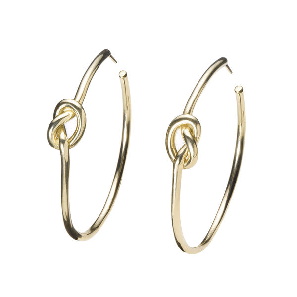 simple solid 18k gold love knot hoop earrings by finn by candice pool neistat perfect for Valentines Day